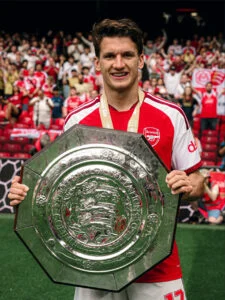 Christos Tzolis holding FA Community Shield trophy photo